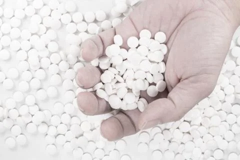Suicide Pills,  Pills, tablets in dead man's hand Stock Photos