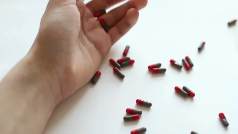Suicide tablet concept. Falling man hand. Stock Footage 88172344