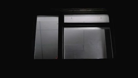 Suicider standing on window sill with bullet in hands, depression after divorce Stock Footage 98965795