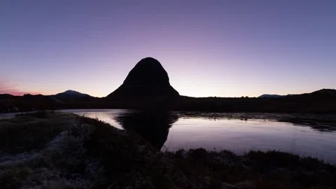 Suilven viewed from its west side at sunrise Stock Footage 261386259