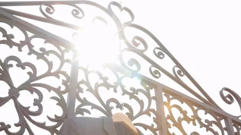Suit Jacket in sun on gate Stock Footage 90909353