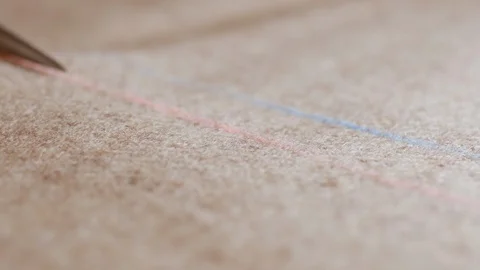 Suit maker design studio on tailoring. The skilled tailor hands cut with shears Video stock 128993425