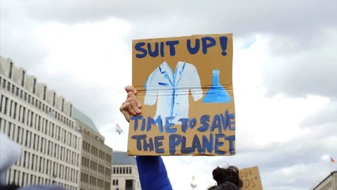 Suit up, time to save the planet, climate change, March for Science sign, Berlin Vídeos de archivo 87452137