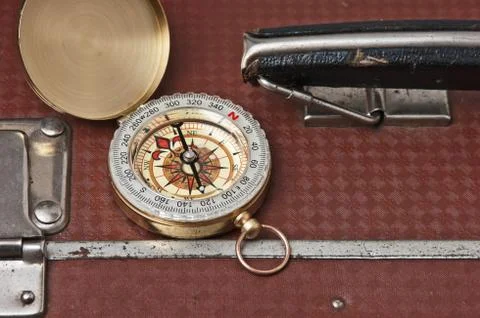 Suitcase and compass 스톡 사진