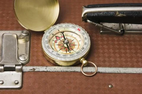 Suitcase and compass Foto stock