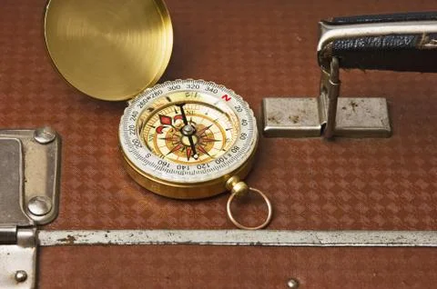 Suitcase and compass Foto stock