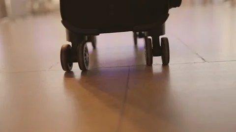 Suitcase being pulled at the airport Stock Footage 166230981