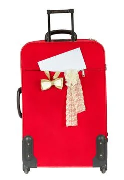 Suitcase with blank white envelop. Vertical. Over white Stock Photos