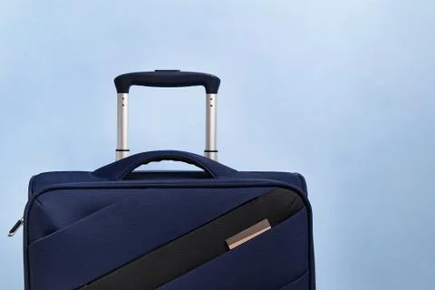 Suitcase on blue background, Stock Photos