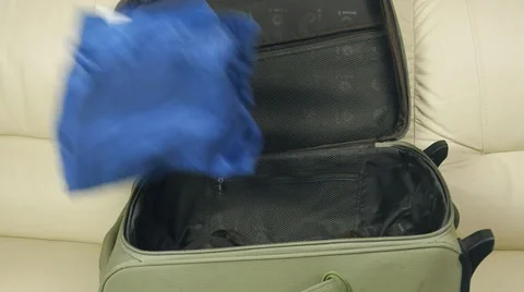 Suitcase with clothing Stock-Footage 61542483