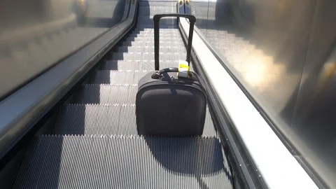 Suitcase Comes Down On An Escalator. Stock Footage 105807054