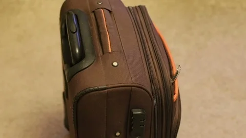 The suitcase is on the floor in the room, close-up. Stock Footage 102679640