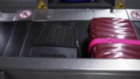 Suitcase moving along a baggage carousel in a modern airport Closeup low angl Stock Footage 256748471