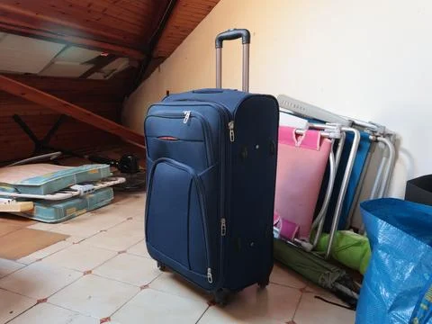 Suitcase, old things in attic. Objects of house. Cleanliness and tidiness of the Stock Photos