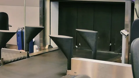 Suitcase Packed in plastic goes in the cargo area Stock Footage 73314194