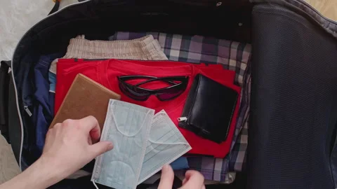 Suitcase packing for vacation Stock Footage 272908109