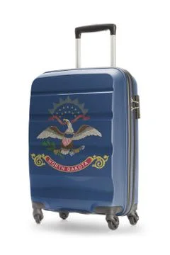 Suitcase painted into US state flag - North Dakota Fotos de archivo