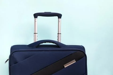 Suitcase on pastel blue background Stock Photos