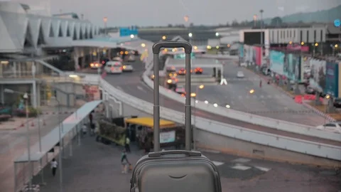 A suitcase with a retractable handle. Baggage bag at the airport against a Stock Footage 122992992