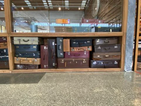 Suitcase standing on floor Stock Photos