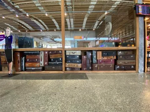 Suitcase standing on floor 스톡 사진