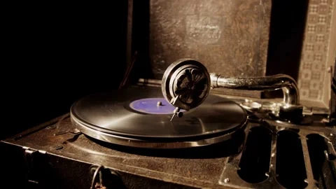 Suitcase style record player spins vinyl disc with label Stock Footage 329559942