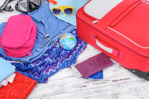 Suitcase with things on the floor. Stock Photos
