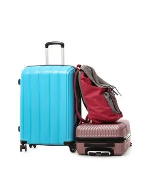 Suitcases and backpack isolated on white background Stock Photos