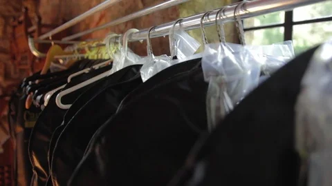 Suits hanging On a Rack Stock Footage 73836239