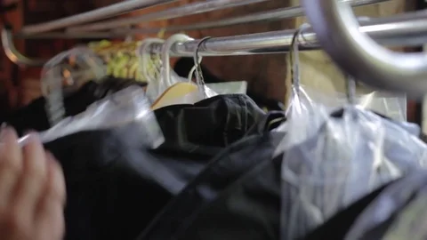 Suits Hanging On a Rack Video stock 74207671