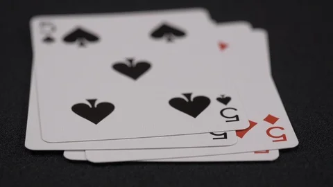 Suits of playing cards, Five moving on a luxury black background 4k Stock Footage 95564661