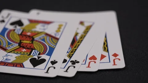 Suits of playing cards, Jack moving on a luxury black background 4k Stock Footage 95565101
