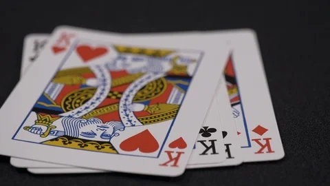 Suits of playing cards, King moving on a luxury black background 4k. Stock Footage 95565251