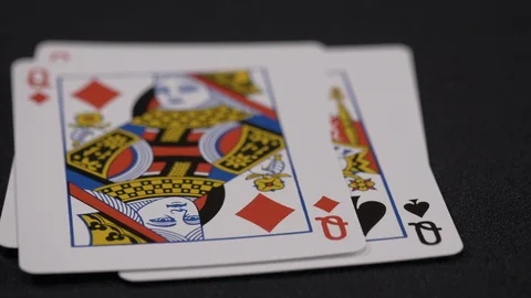 Suits of playing cards, Queen moving on a luxury black background 4k. Stock Footage 95565760