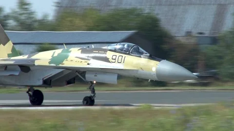 Sukhoi Su-35 (Flanker-E) is turn on runway around its axis. Stock Footage 115012789