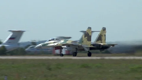 Sukhoi Su-35 (Flanker-E) accelerates on runway and takes off. Stock Footage 115012795