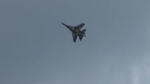 Sukhoi Su-35 multipurpose fighter aircraft (Flanker-E) performs aerobatics. Stock Footage 115242153
