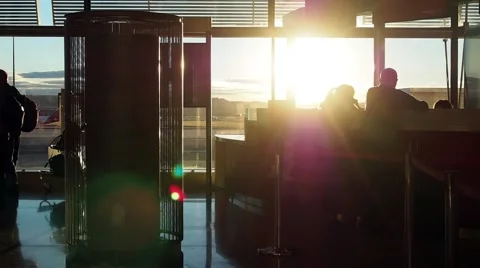 Sulhouettes of Passengers Waiting in a Queue For Boarding at the Gate in Stock Footage 68115686