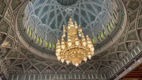 The Sultan Qaboos Grand Mosque  ceilings chandelier design   Stock Footage 233854425