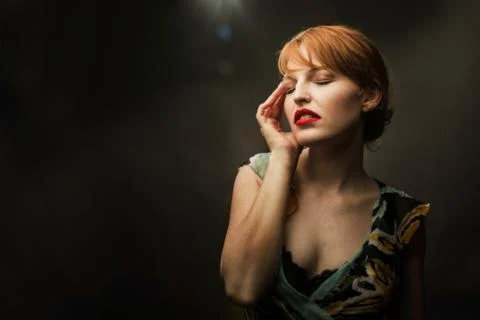 Sultry Redhead with Deep Red Lips Stock Photos