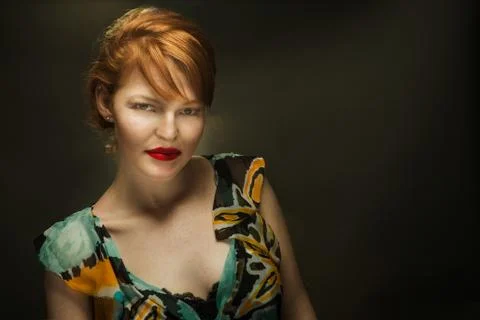 Sultry Redhead with Deep Red Lips 스톡 사진