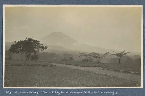 Sumbing volcano on Java seen from the front garden of Hotel Dieng in Wonos... Stock Photos