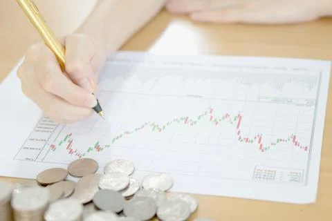 Summary report and financial analyzing concept, Pen and coins Stock Photos