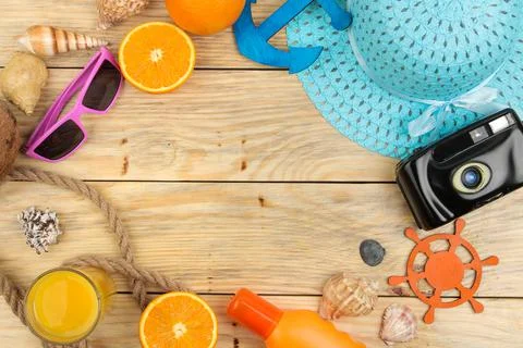 Summer accessories. beach accessories. hat, sunscreen, sunglasses, camera, an Stock Photos