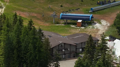 Summer aerial of ski resort base and chair lift in Stevens County Washington Stock-Footage 337834989