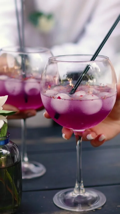 A summer alcoholic purple drink A close-up of lemonade for freshness. Video stock 336617616