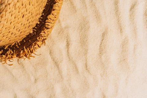 Summer background of beach sand with hat Stock Photos