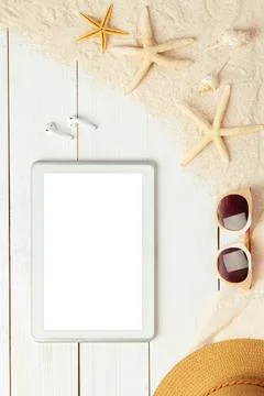 Summer background with blank screen tablet computer and beach accessories -.. Photos