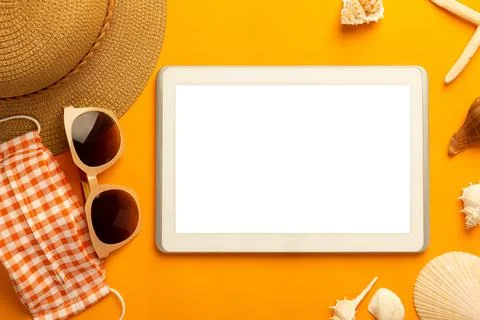 Summer background with blank screen tablet computer and beach accessories, .. Stock Photos