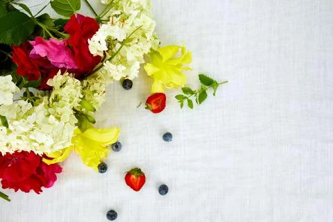 Summer background flat lay hydrangea bouquet and berry Stock Photos